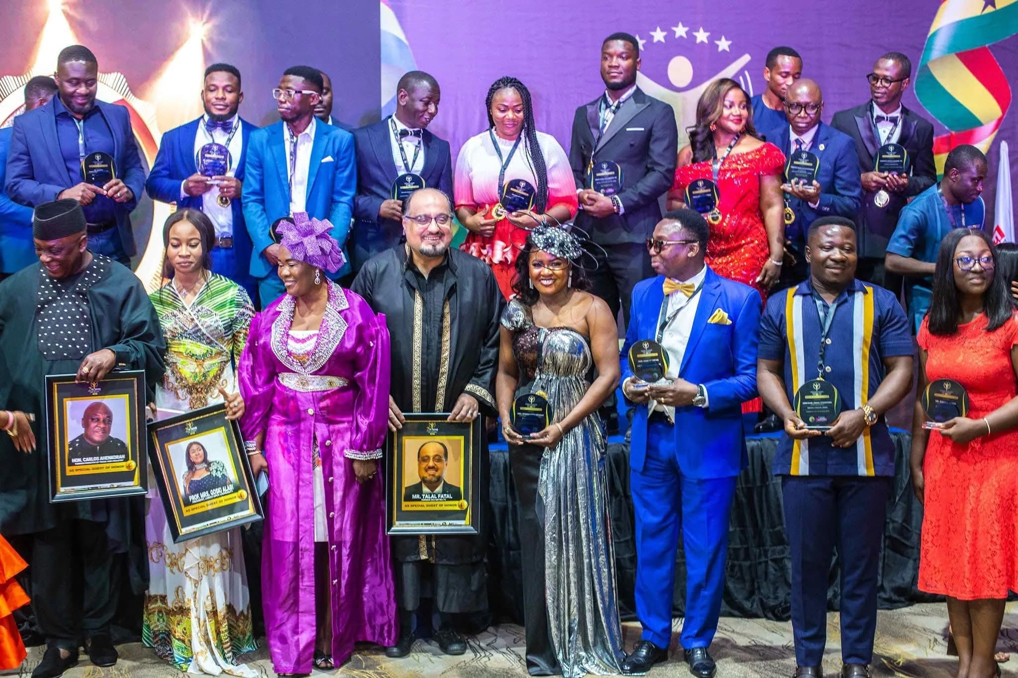 Two women with trophies and a GOPA banner, Ghana Outstanding Personality Award 2026